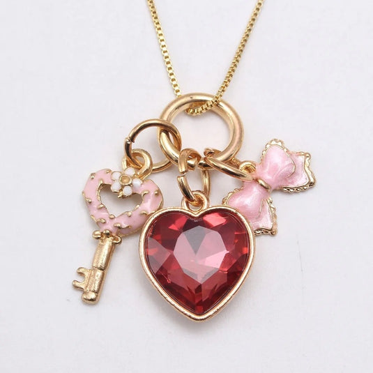 Crystal studded Heart Pendant with delicate Key & Bow Multiple Charm Pendant
