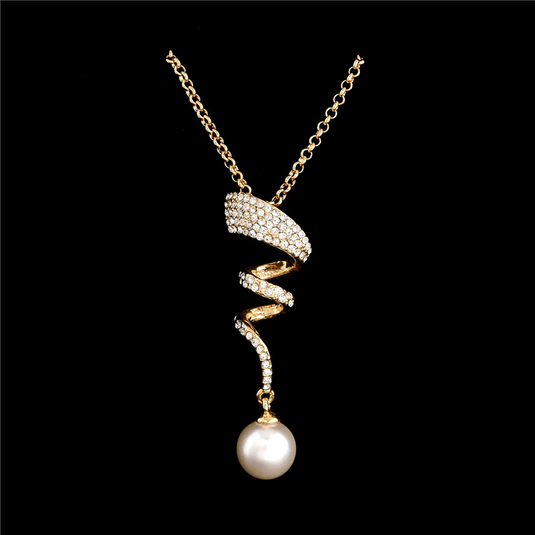 Vintage spiral traditional and western design. Crystal studded set with earrings and a pendant