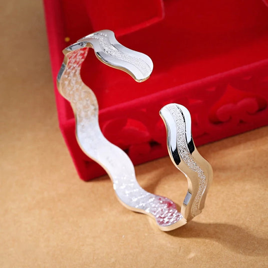 Wavy Design Cuff Bangle in a White Gold Finish