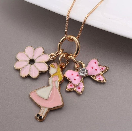Dancing Doll Multiple Charm Pendant with a Flower and a Pretty Bow in Pink color
