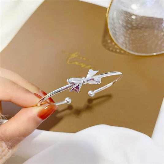 White Gold Plated Cuff Bangle in a Pretty Bow Design
