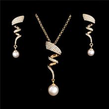 Load image into Gallery viewer, Vintage spiral traditional and western design. Crystal studded set with earrings and a pendant