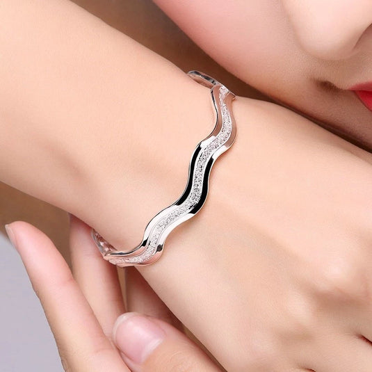Wavy Design Cuff Bangle in a White Gold Finish